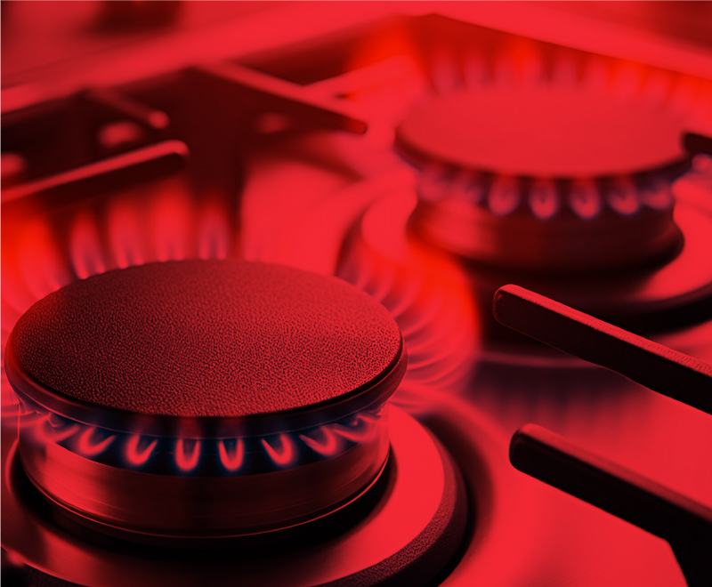 two gas stove burners with flames