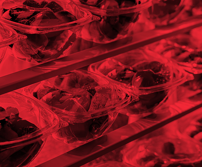 rows of glass dishes in a commercial refrigerator