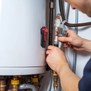 a tech repairs a water heater