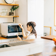 a child operates a countertop oven