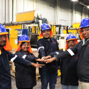 Team of construction workers touching hands