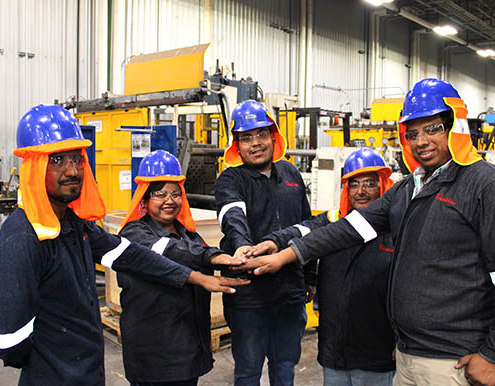 Team of construction workers touching hands